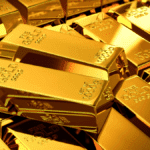 Prezzo dell’oro in crescita: L’impatto della Politica Monetaria e della Geopolitica.